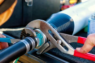 Pipe repair service using professional plumbing tools in Lawrenceville, Georgia